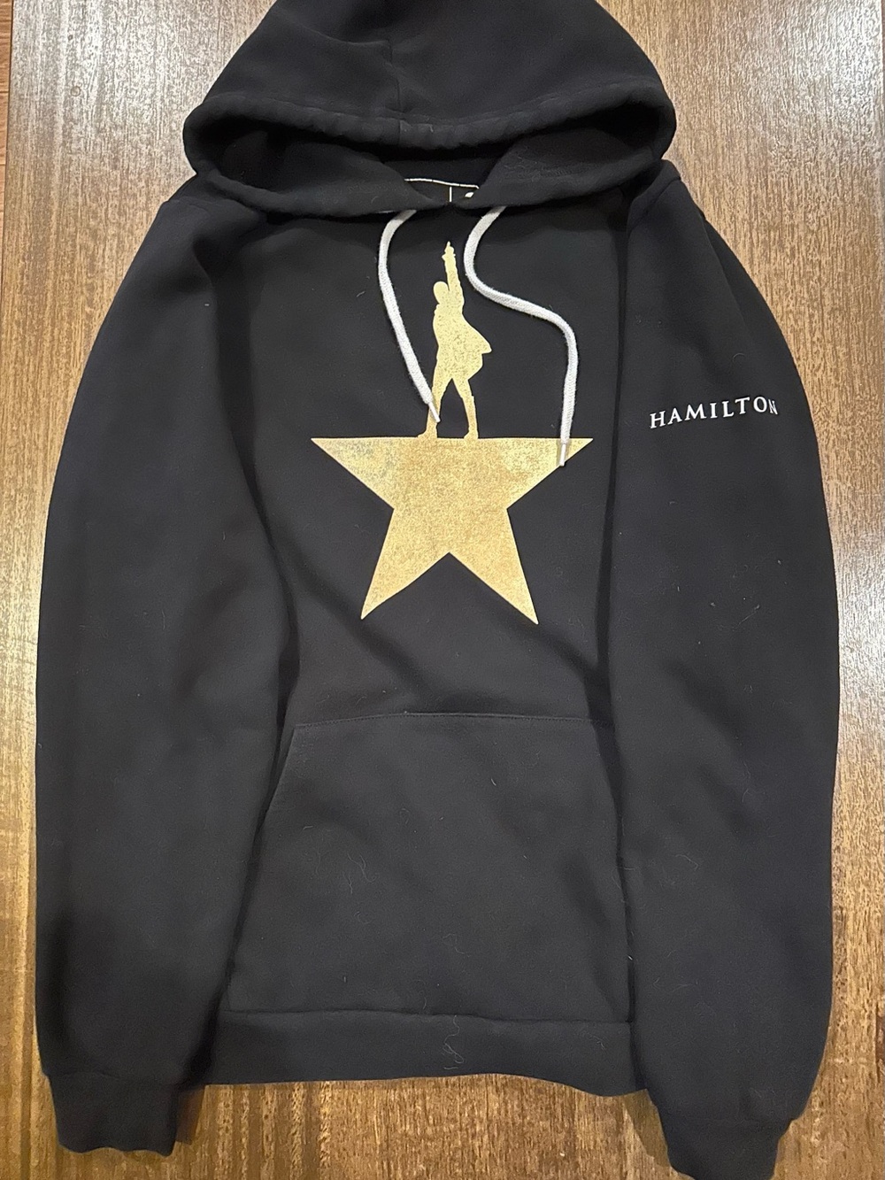 Official Hamilton merchandiseBlack Hoodie with Gold Accent and White Drawstrings